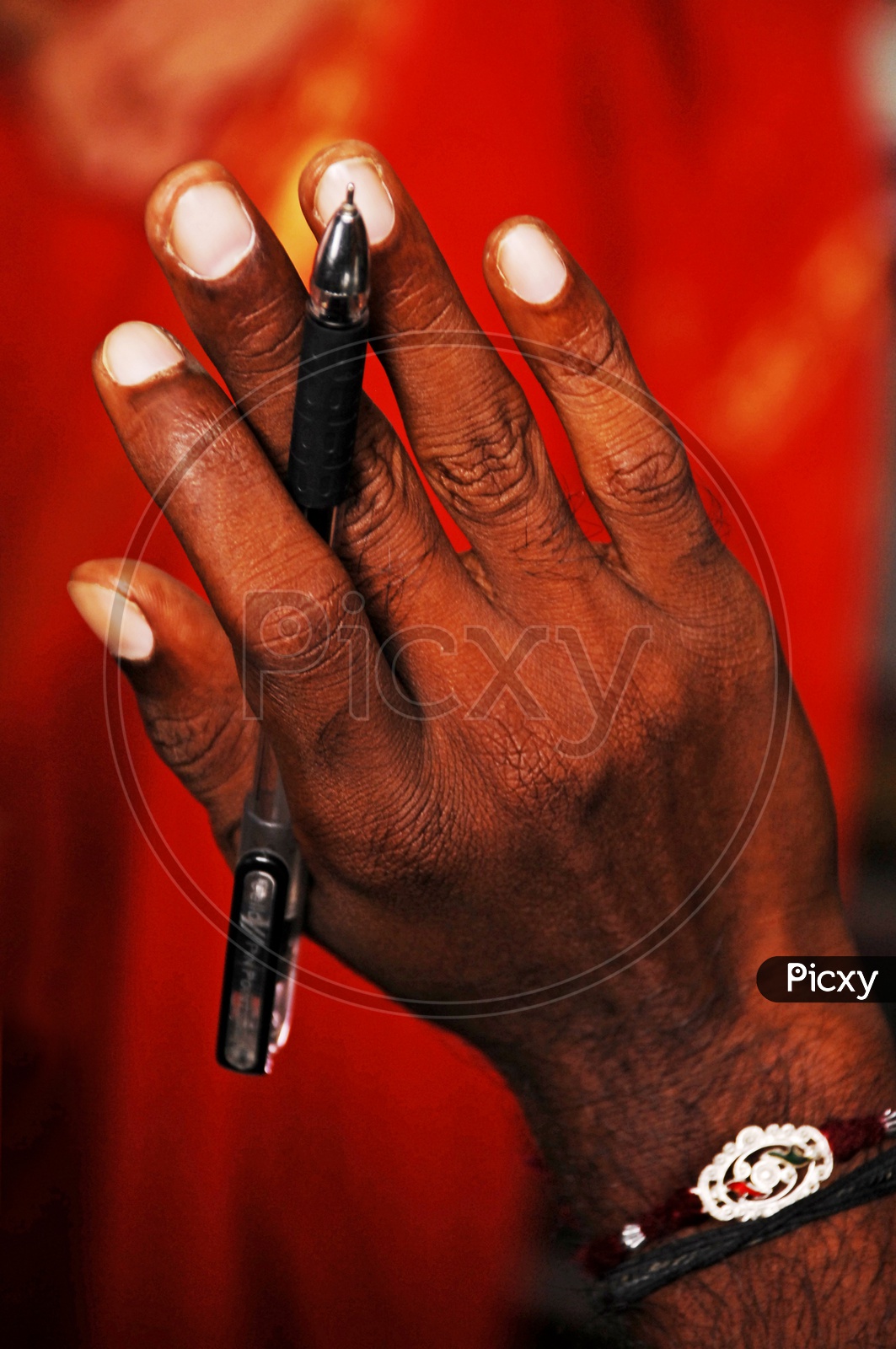 A  Man Holding a Pen In Hand