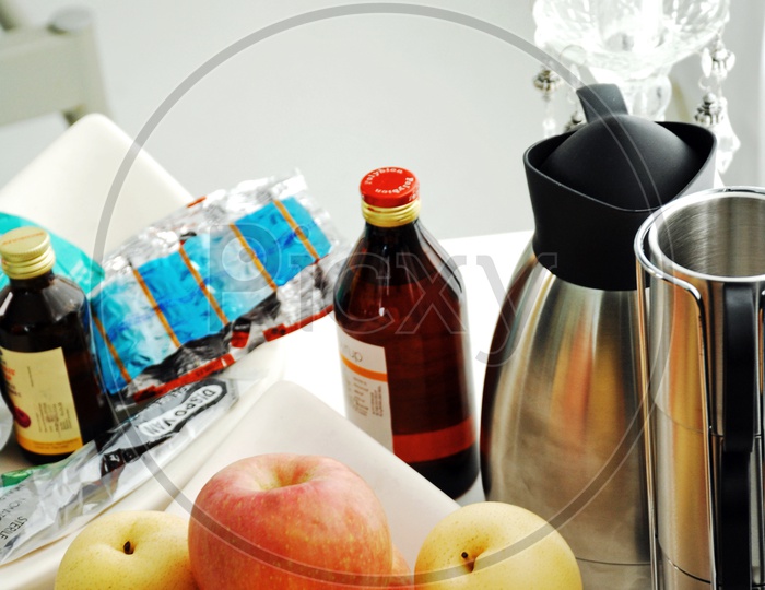 Medicines and Fruits In a Hospital Table