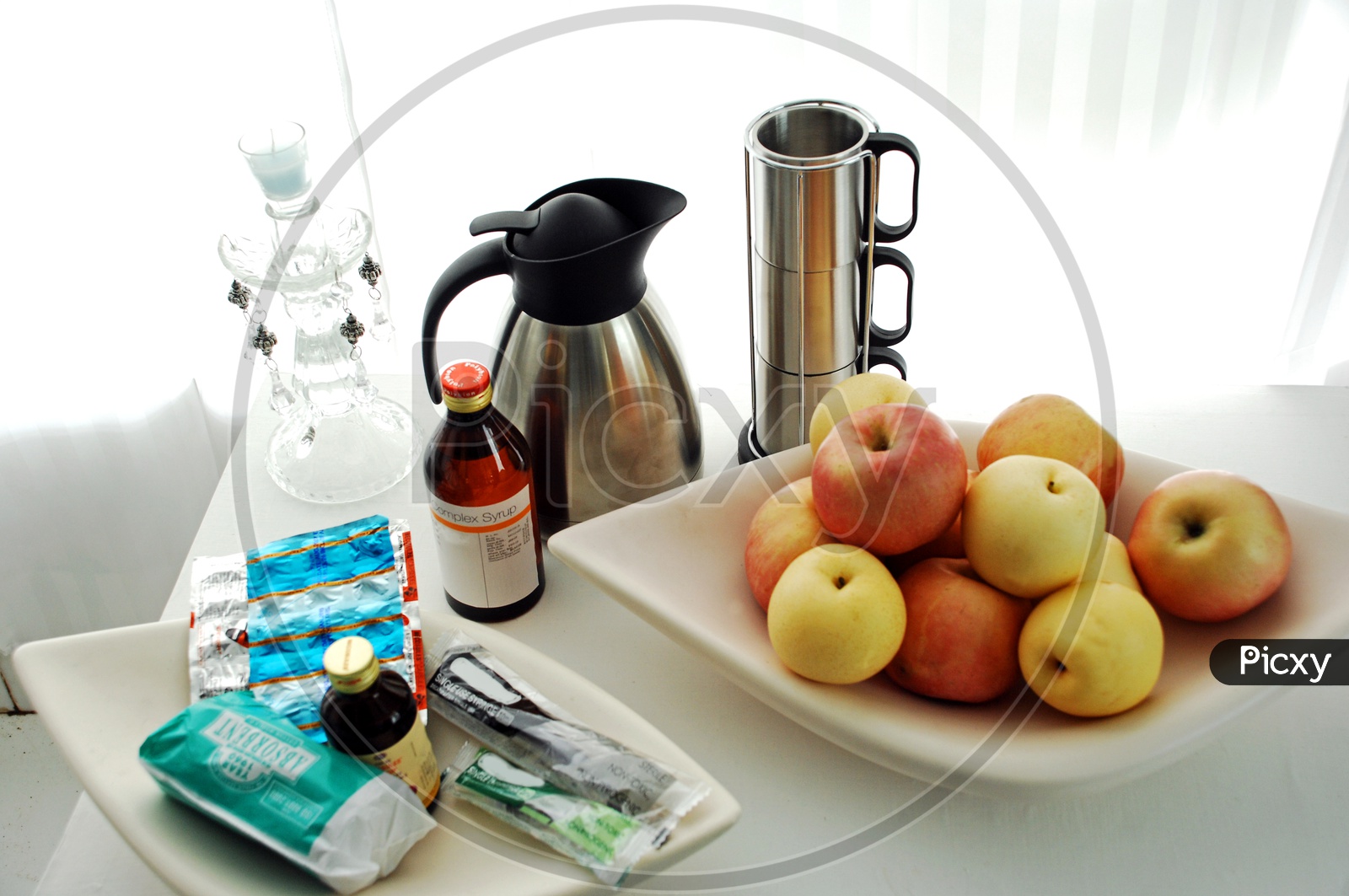 Medicines and Fruits in a Hospital Room Table