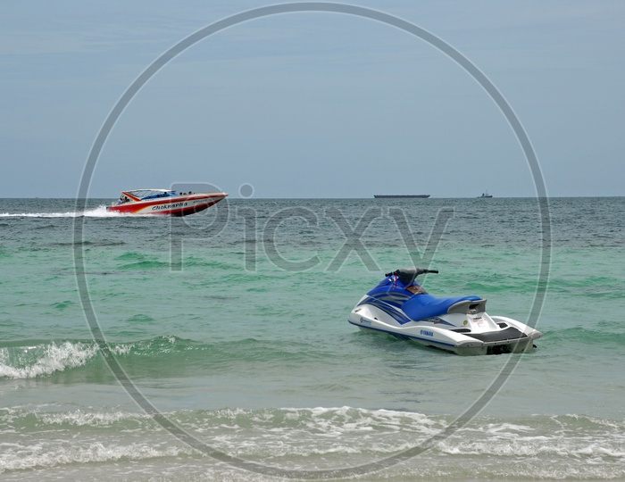Speed Boats Anchored In Sea