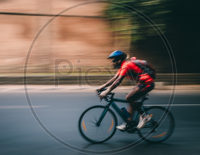 Pan shot of a cyclist on the roads of Pune