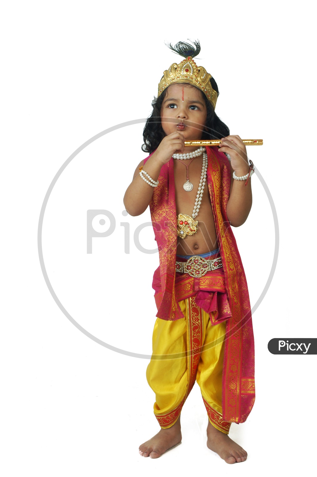 Boy dressed on sale as krishna