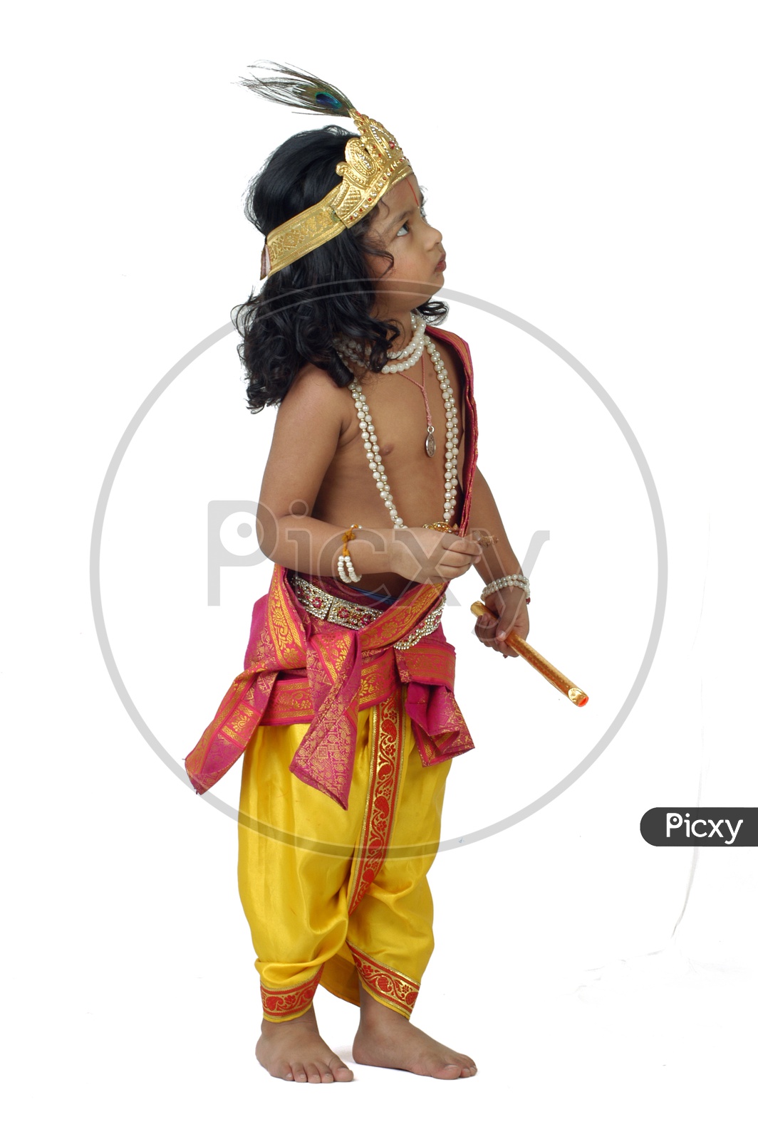 A little boy dressed up as Hindu God Krishna