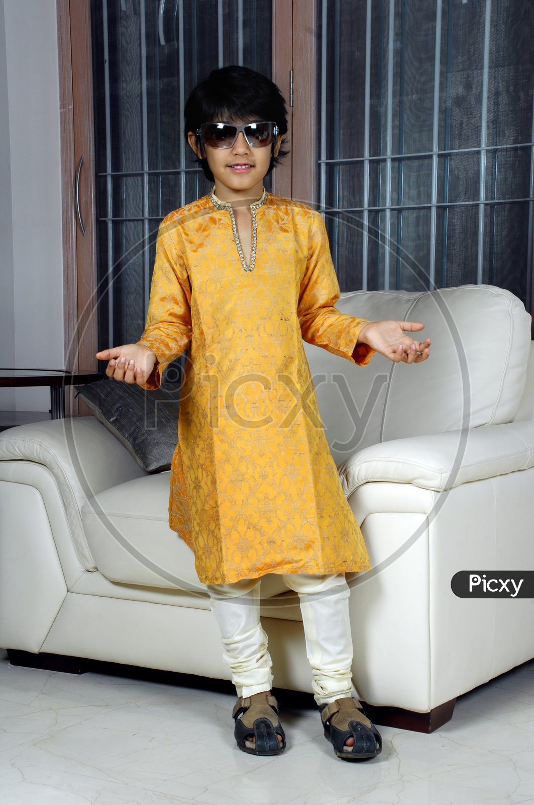 Indian boy wearing yellow kurta pyjama