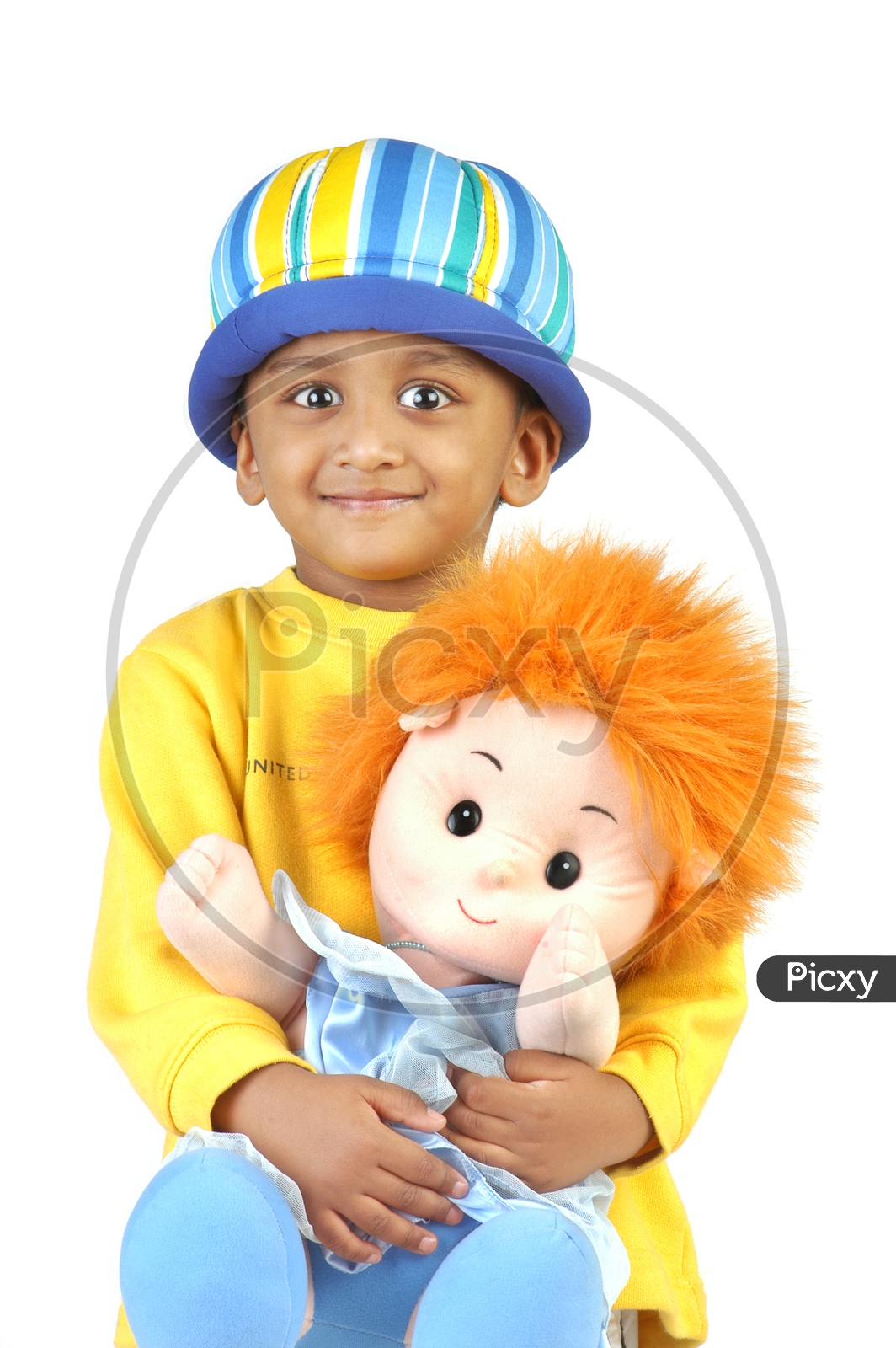 Indian boy wearing yellow t-shirt playing with toy