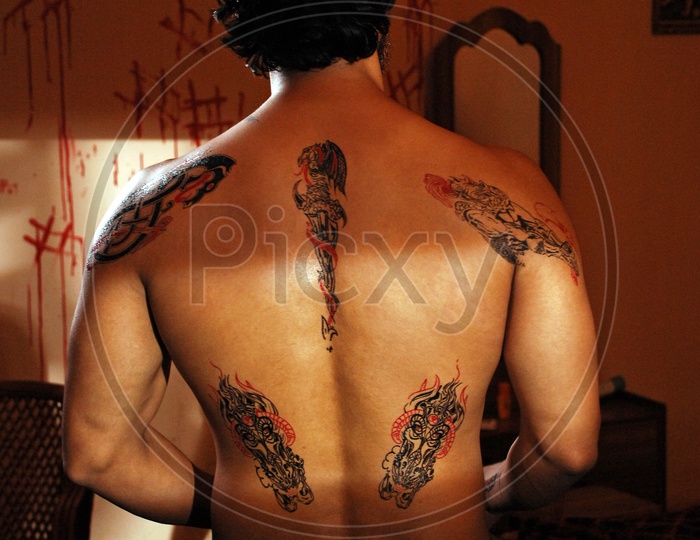 Tattoos on the upper back of a man