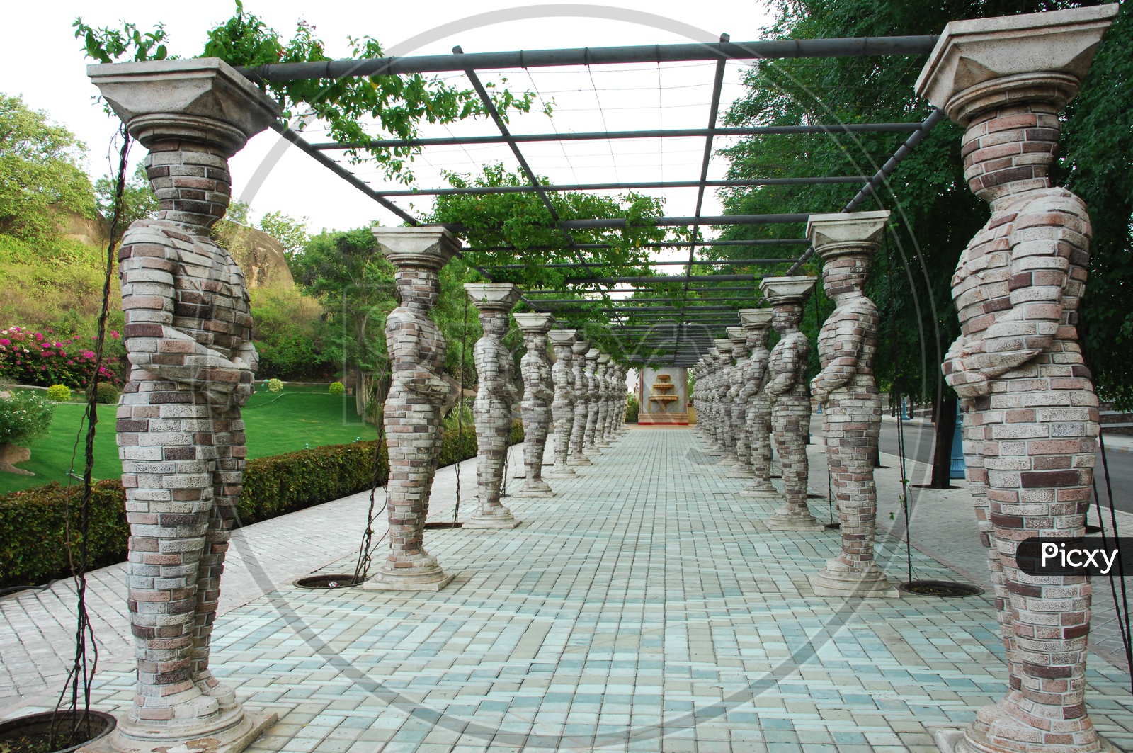 Human shaped pillars support for the creeper plant