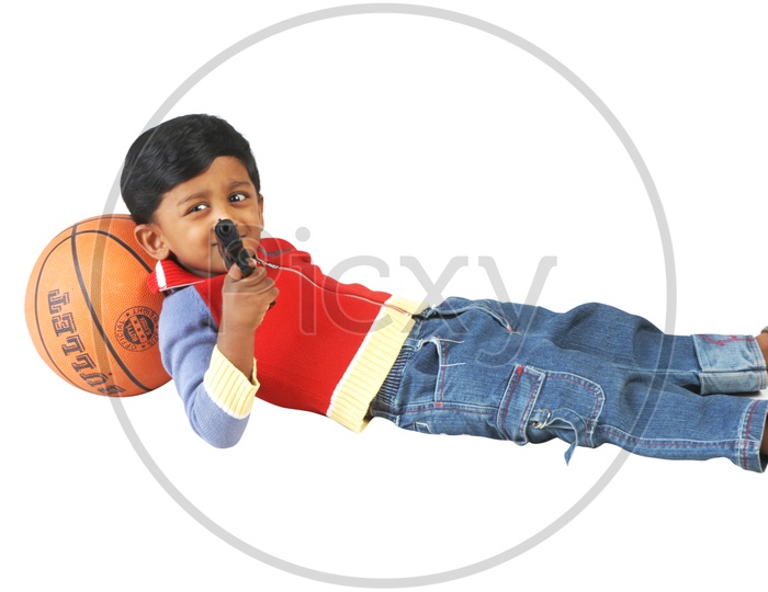 Indian boy holding a toy gun