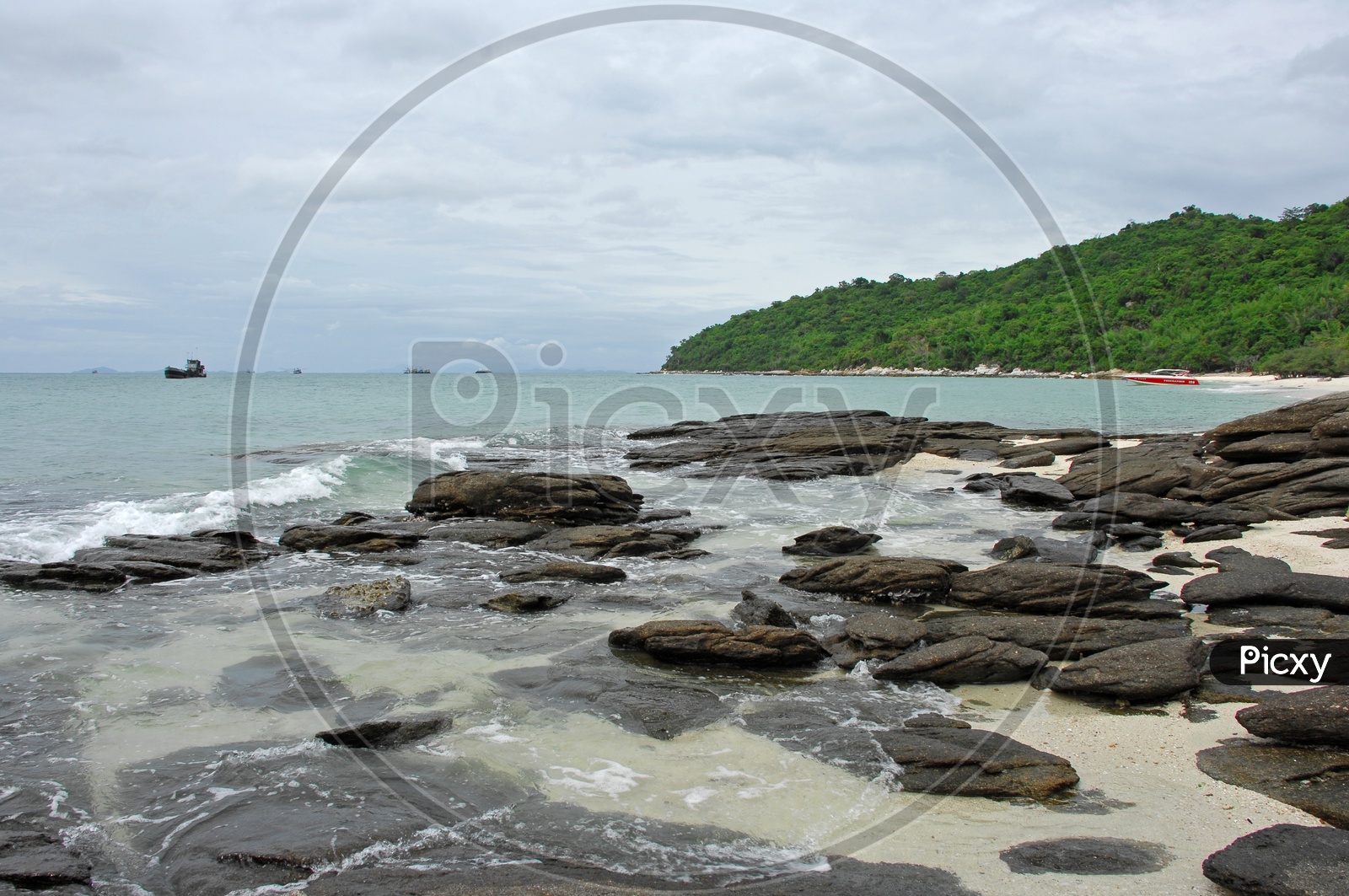 Rock beach With Waves  Striking To Rocks