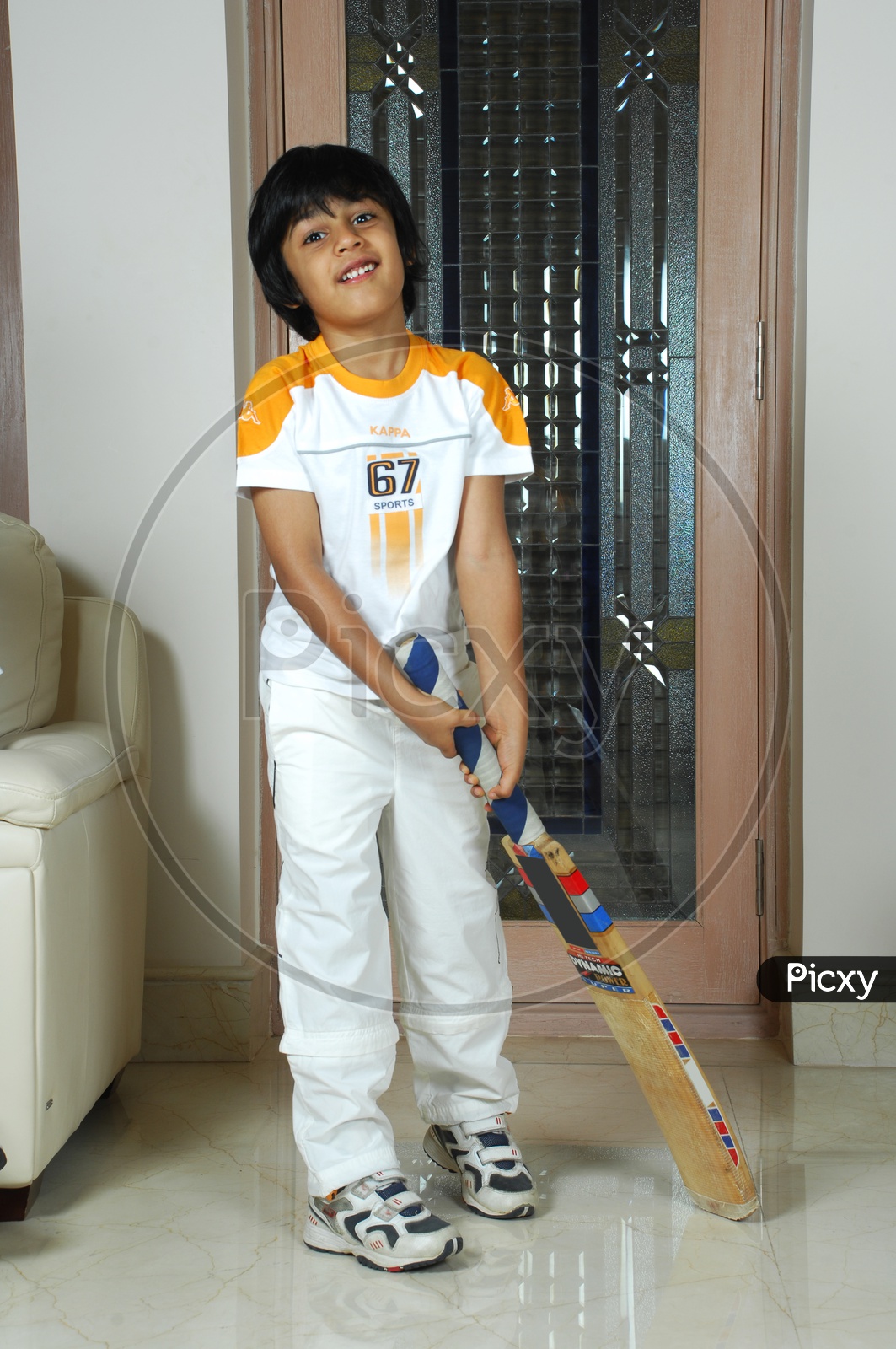 Indian boy holding cricket bat