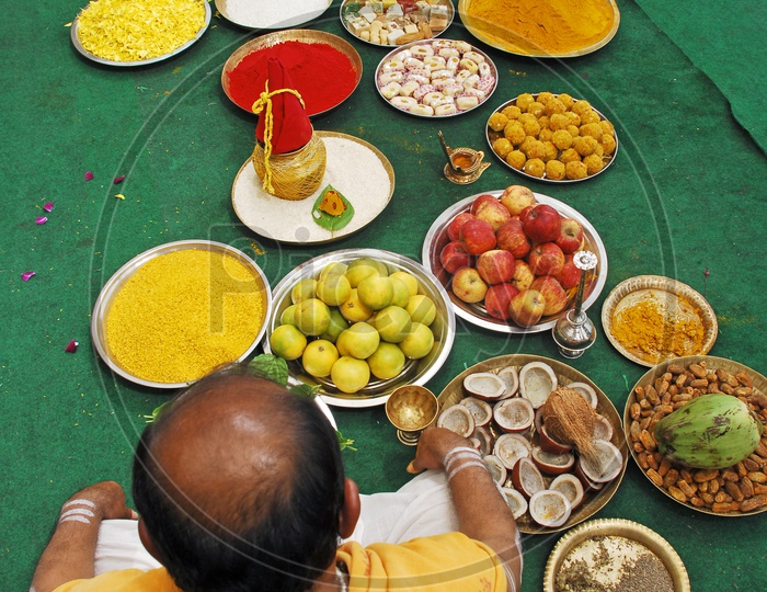 Priest Performing Pooja In a Event With Pooja plates Present