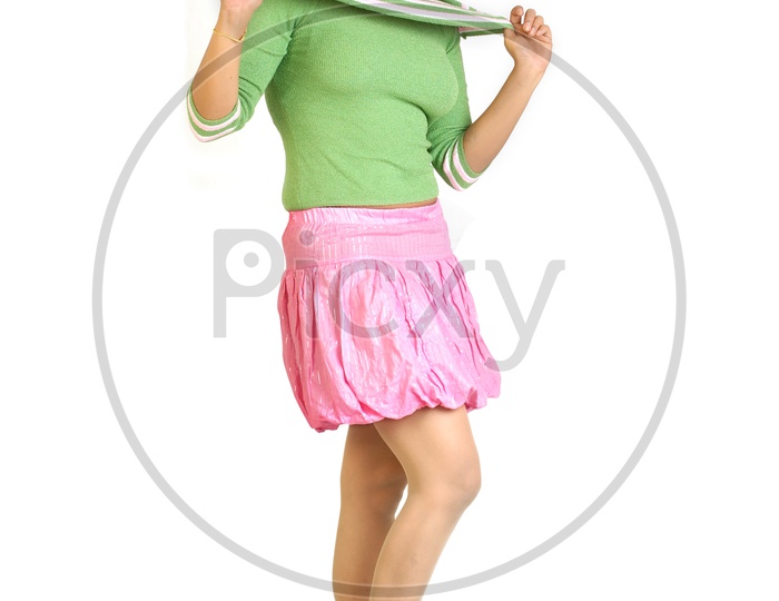 Indian woman wearing pink skirt and green top