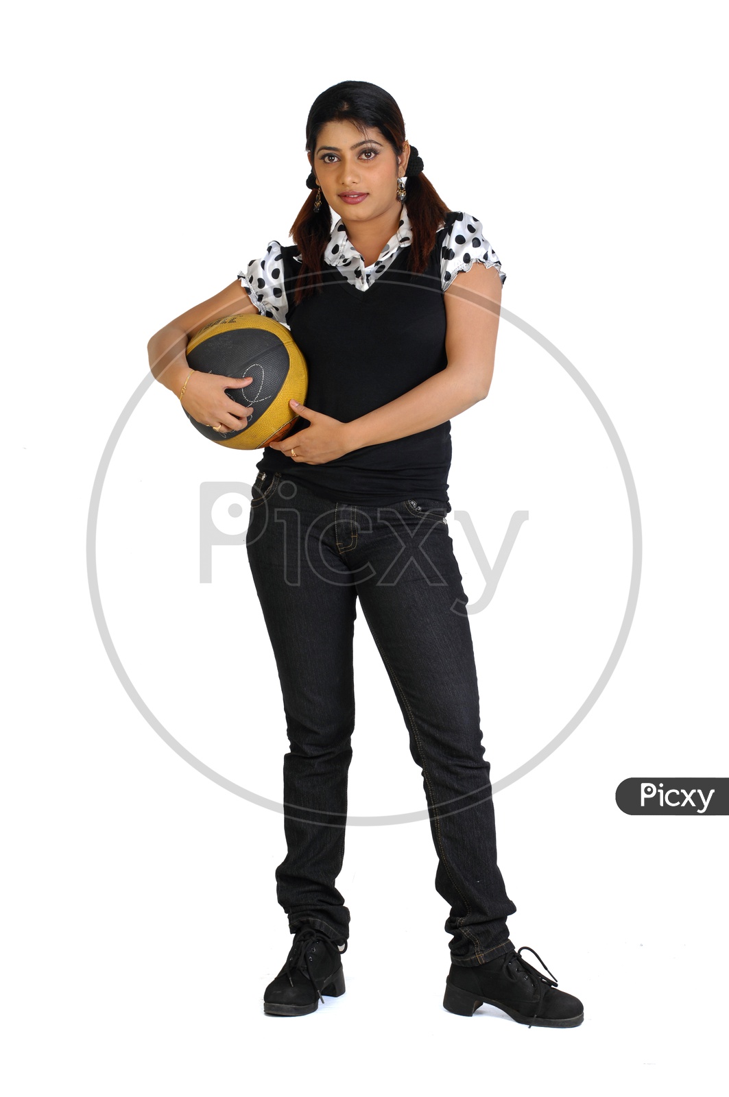 Indian Woman holding a throw ball