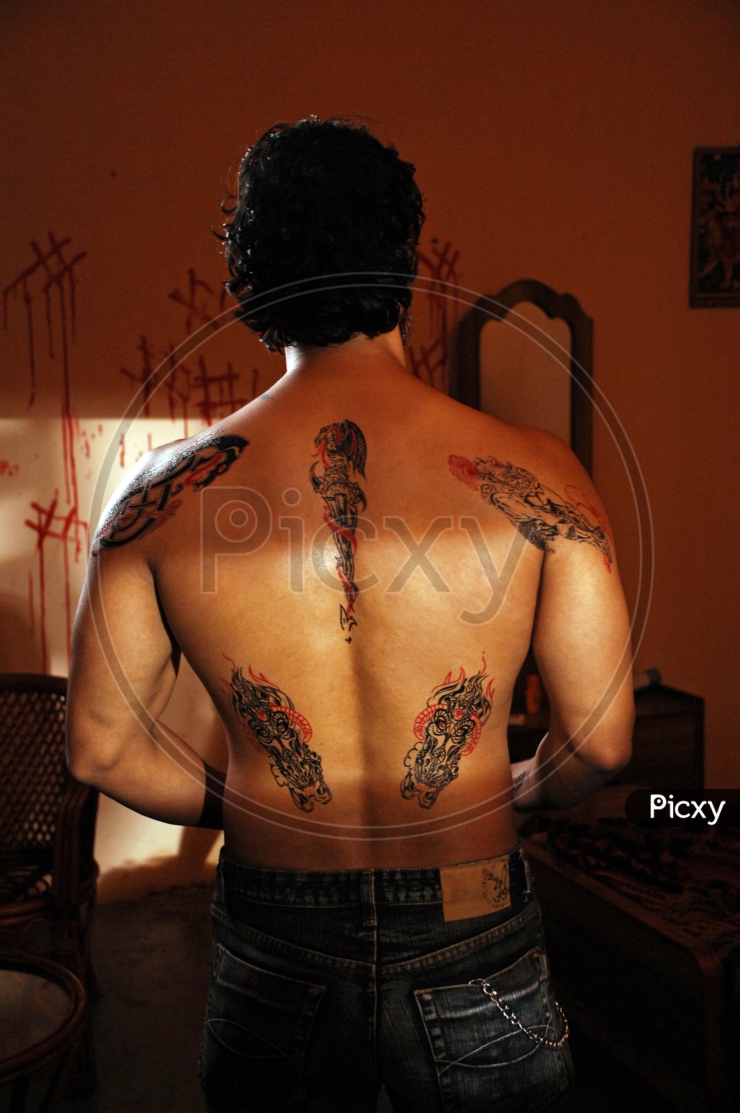 Tattoos on the upper back of a man