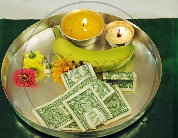 American Dollars On a Hindu God Pooja Aarthi Plate