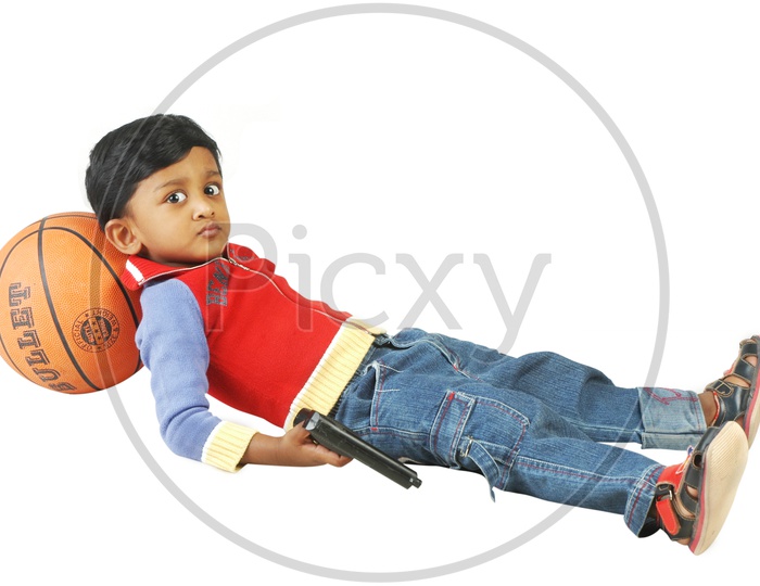Indian boy holding a revolver