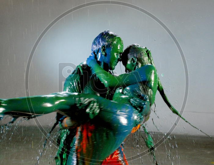 A couple dancing with dripping colors