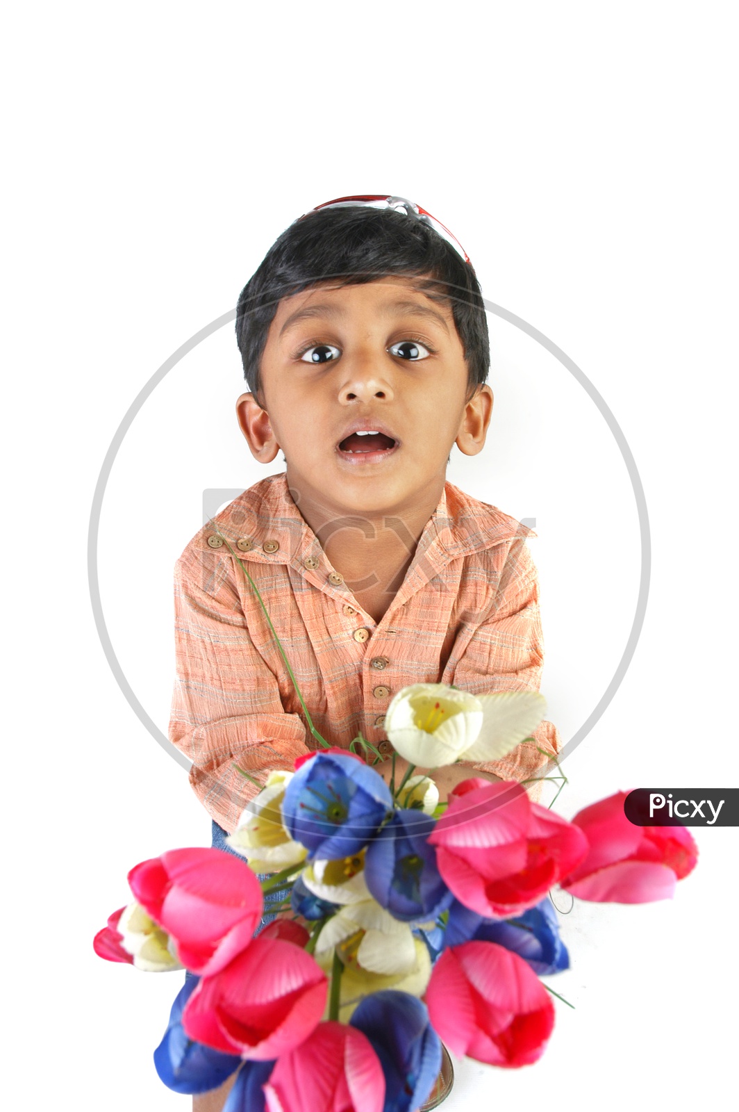 Indian boy holding flowers
