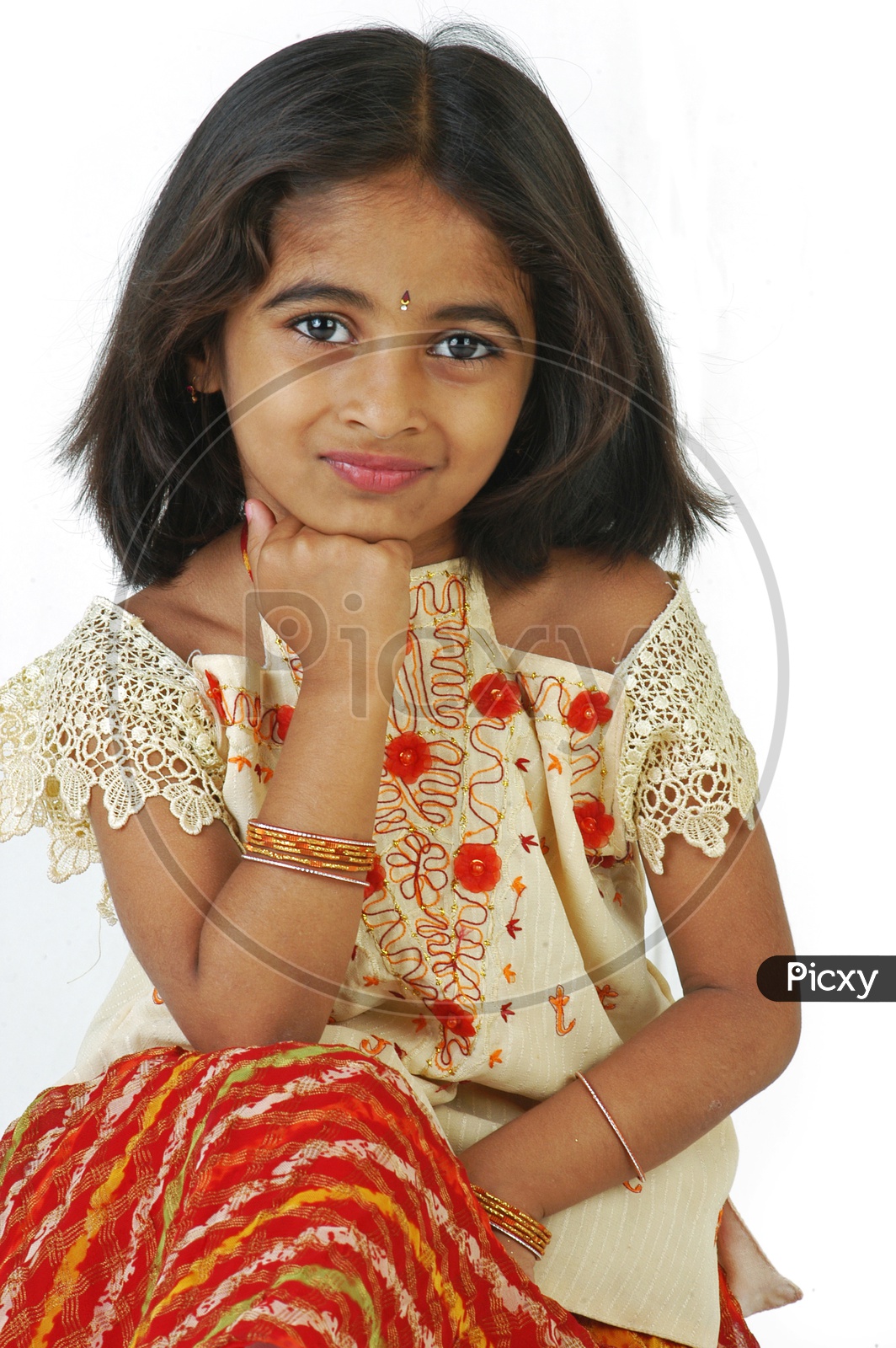 Beautiful little girl posing sitting on the floor. Stock Photo by  ©lotosfoto1 145852461