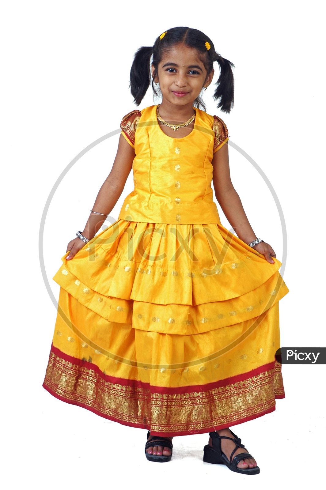 A little girl wearing traditional attire