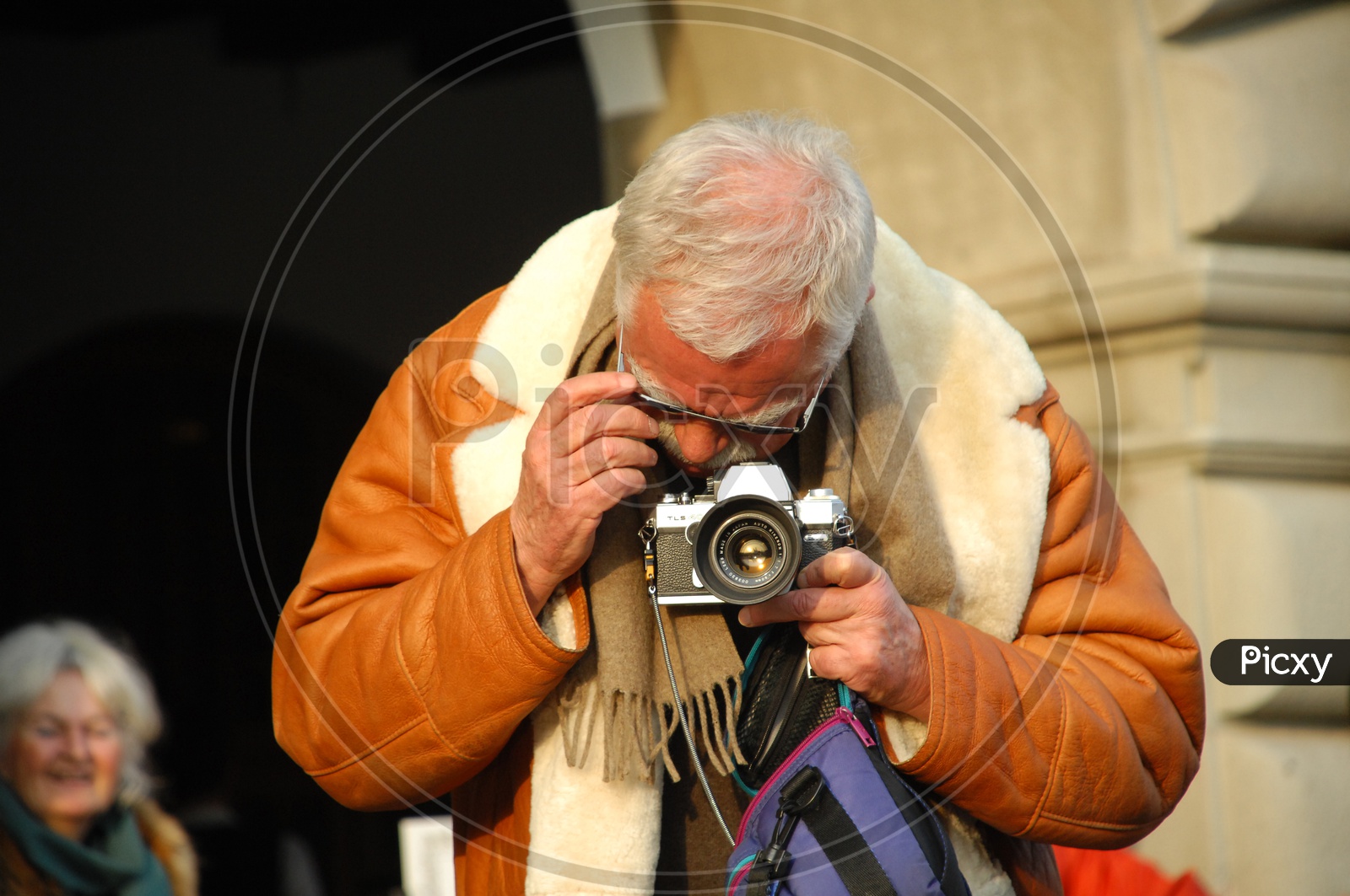 A man taking picture with vintage camera
