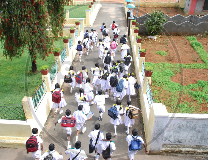 School kids running out from the school