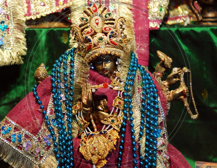 Hindu Goddess decorated with beaded chains
