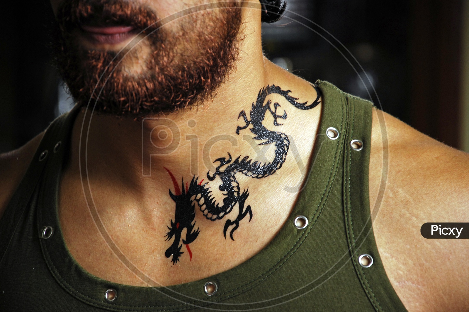 Black and grey dragon tattoo on the neck and head