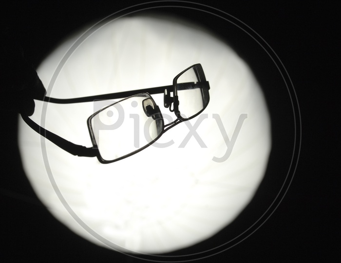 Silhouette of reading glasses