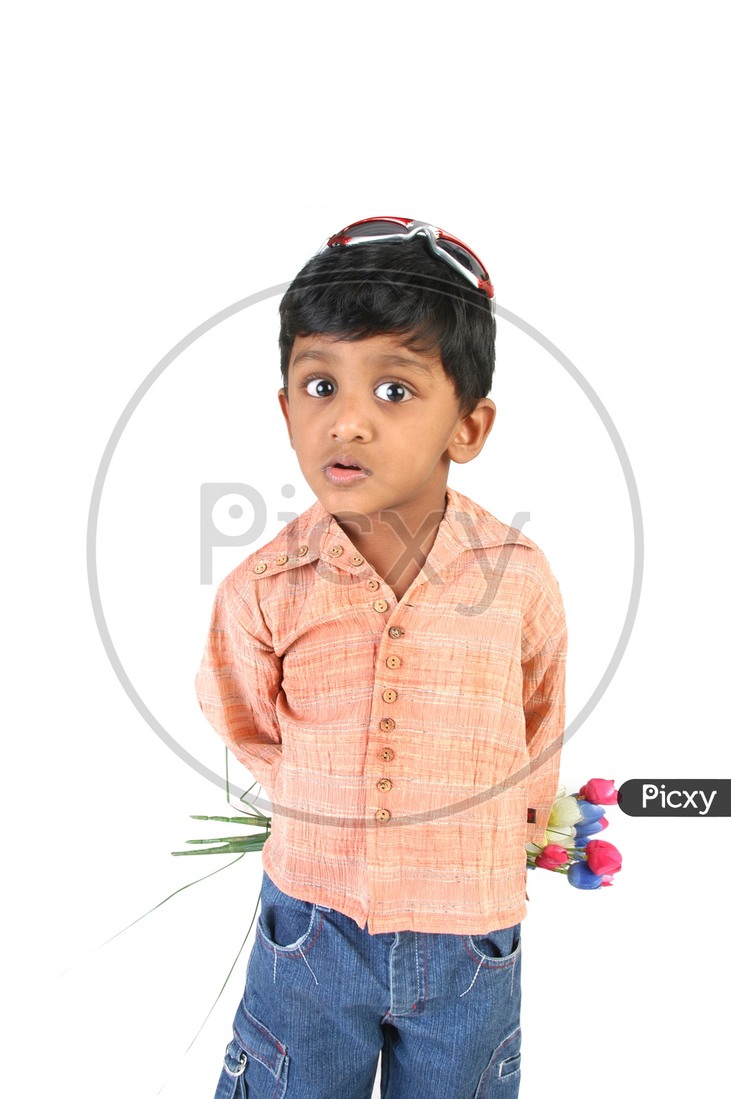 Indian boy holding flowers