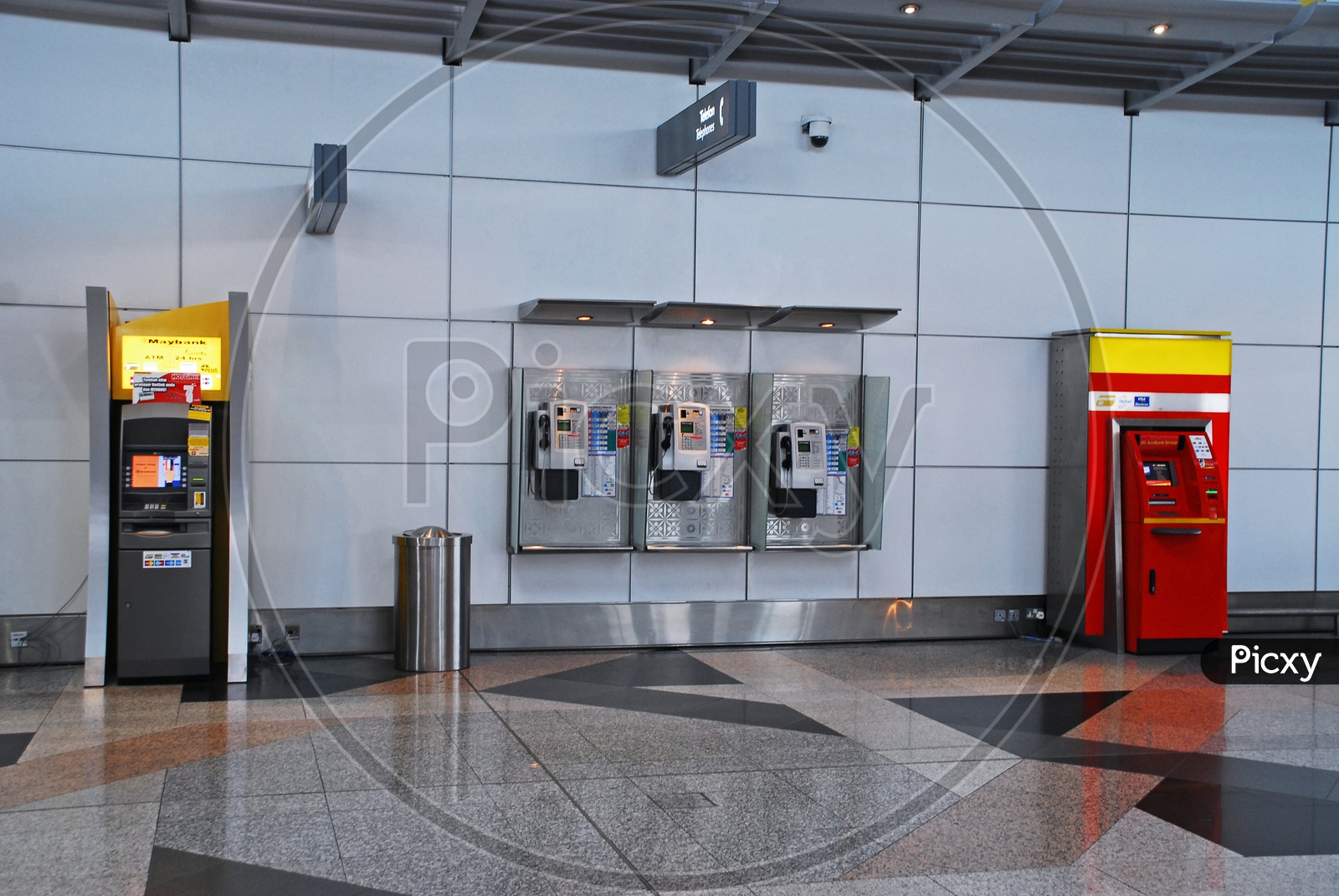 ATM machines and pay telephones in an airport