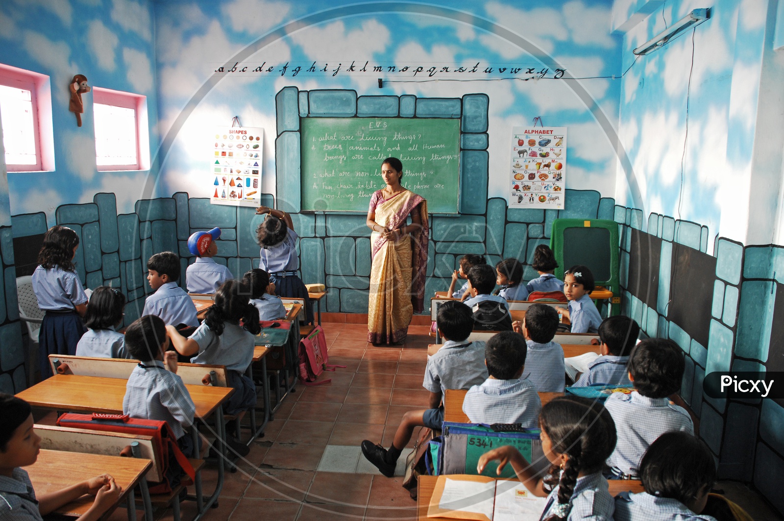 A Lady Teacher Teaching In a Classroom In a Kids School