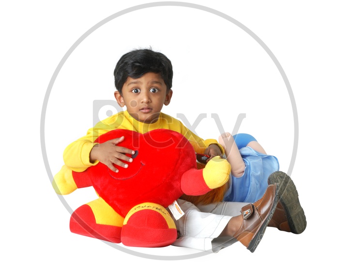 Indian boy playing with toys