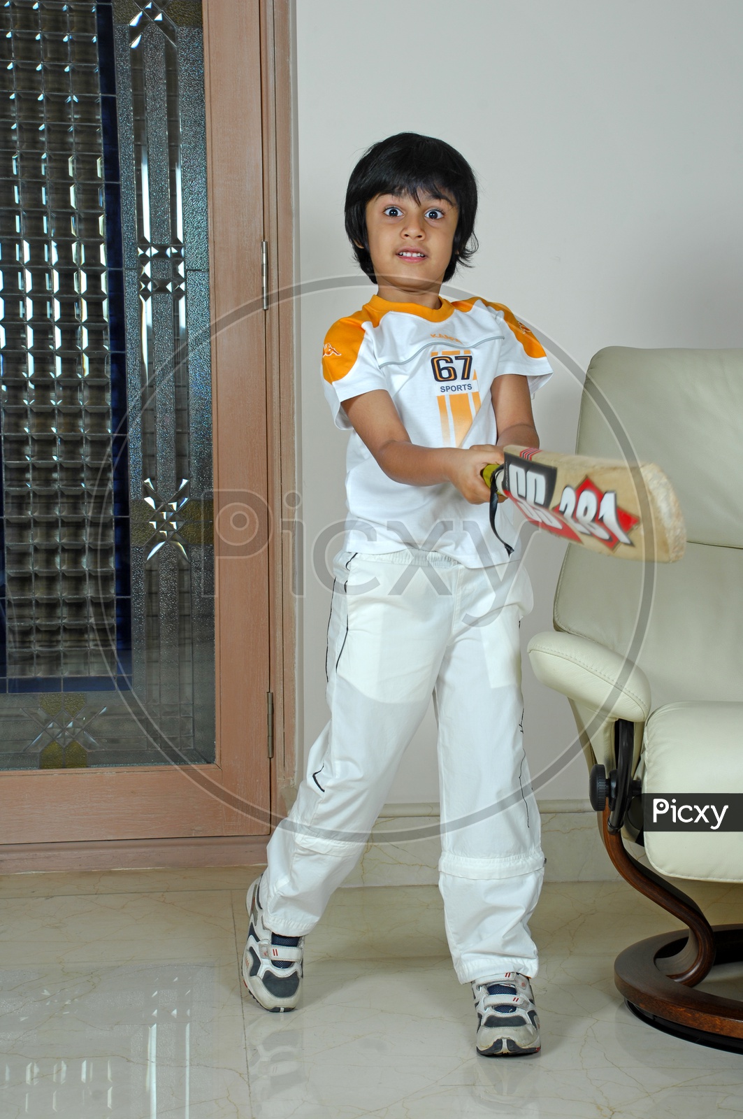 Indian boy holding cricket bat
