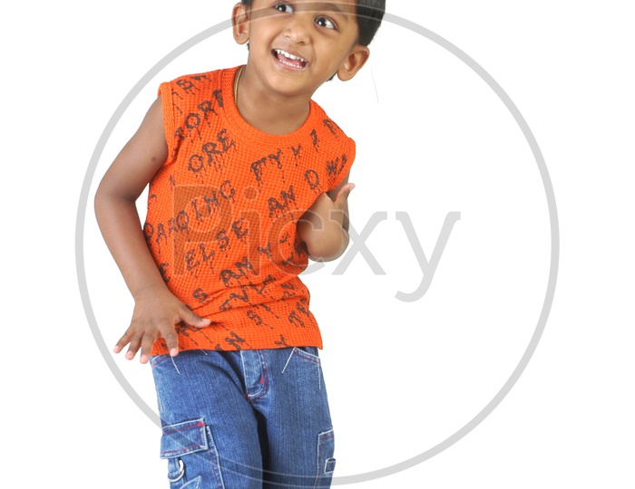 Indian boy standing wearing a sleeveless