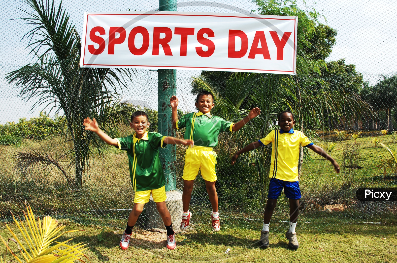 School boys jumping wearing sportswear