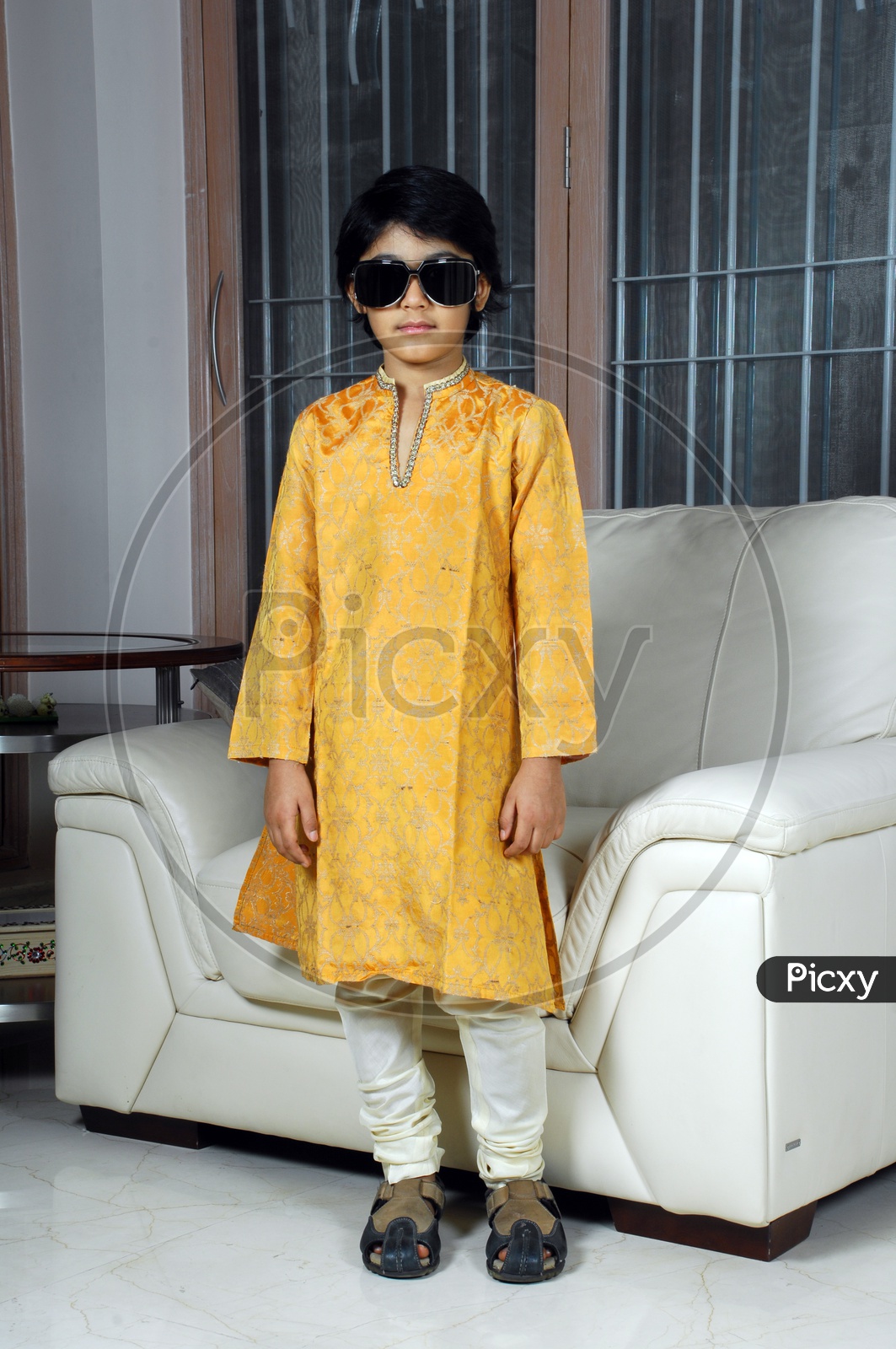 Indian boy wearing kurta pyjama and sunglasses