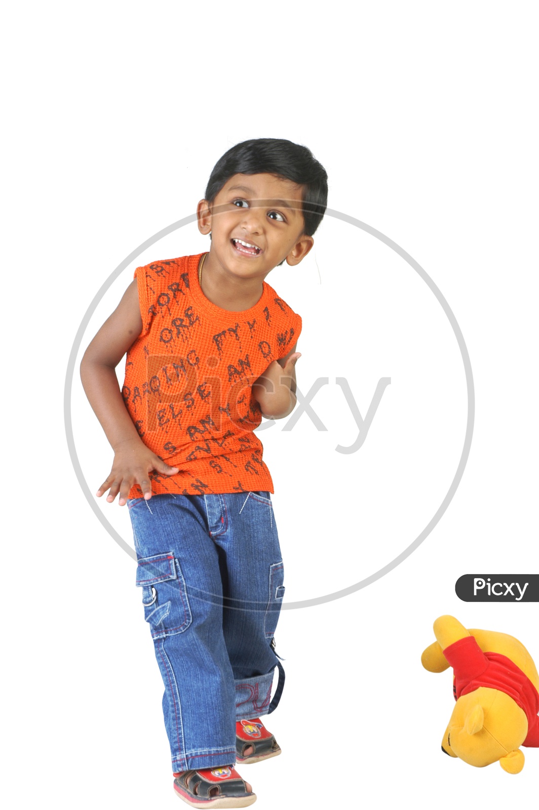 Indian boy standing wearing a sleeveless