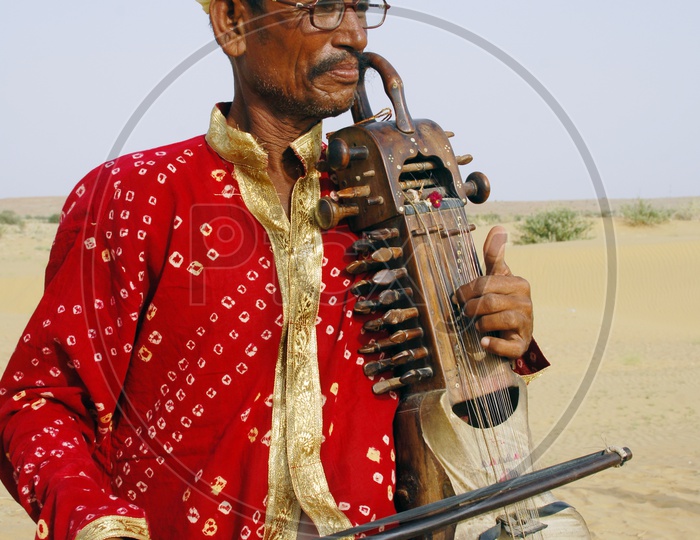 Rajasthani Man playing an ancient violin