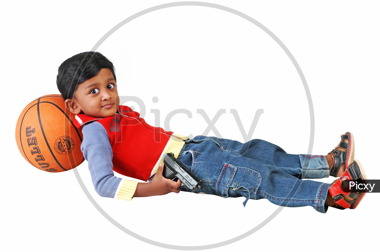 Indian boy holding a revolver