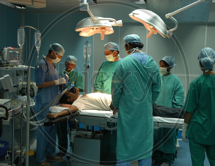 Surgeon team performing a surgery in operating theater