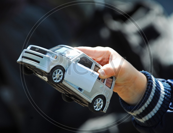 A Car Toy in Child Hand