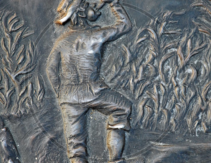 Illustration of an English man embossed on a metal surface