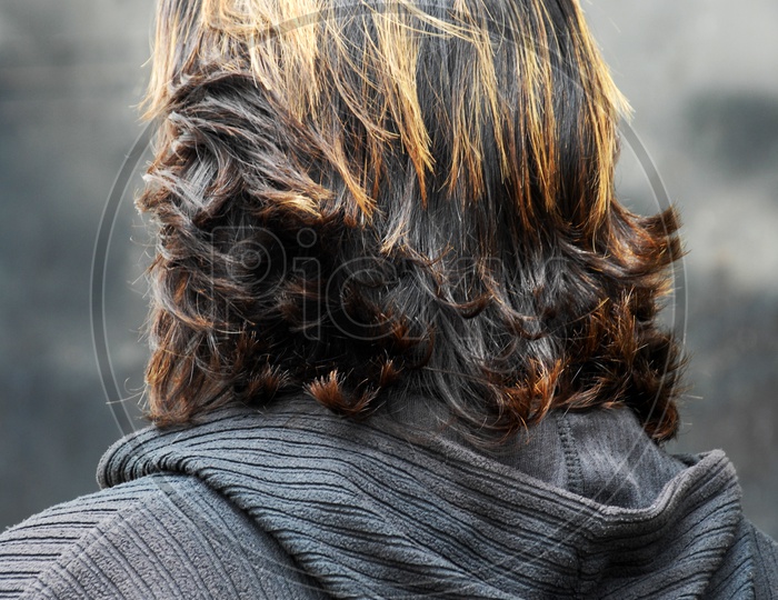 Blonde streaks of a Indian Man's hair