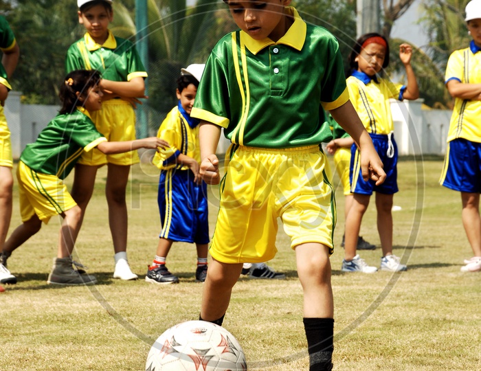 School kids playing football