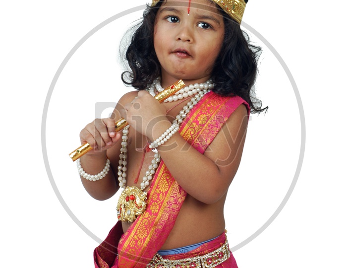 A little boy dressed up as Hindu God Krishna