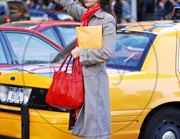 Foreign woman calling for a taxi