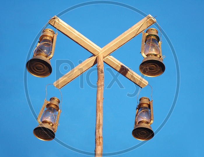 Lanterns hanging onto a wooden pole