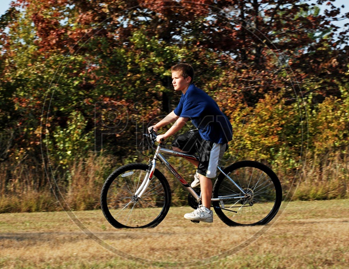 A boy riding bicycle