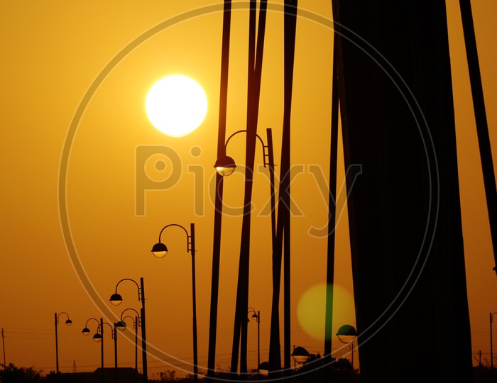 Silhouette of street lights during sunset